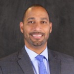 A headshot of Moises Feliz, the AVP of Lending/Office Manager at Unity National Bank .